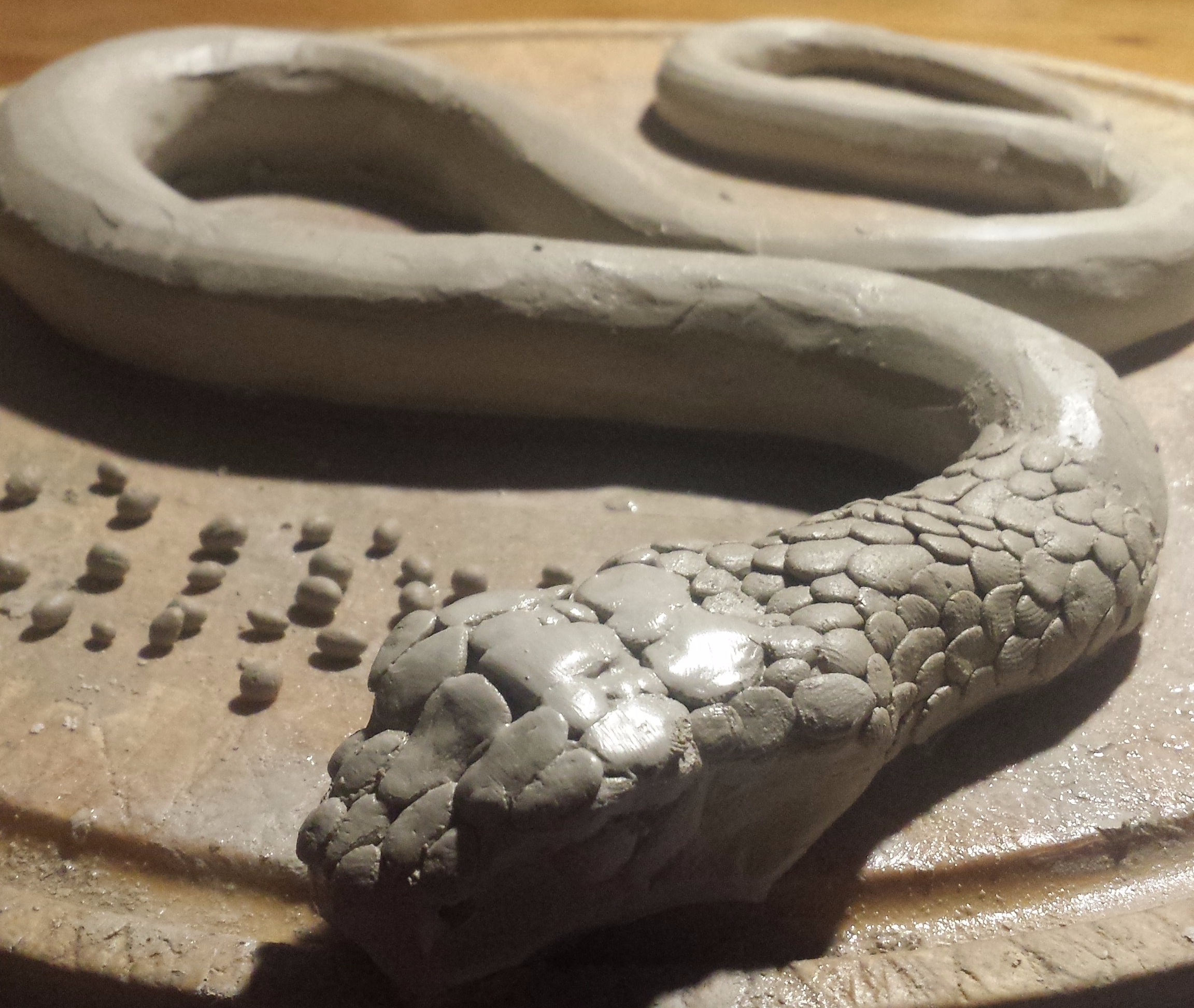 clay snake sculpture